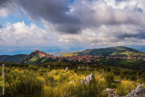 top view of the village of Grisolia with a cloudy sky in the background, Cosenza