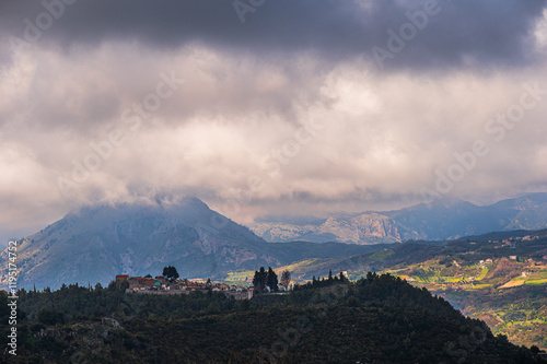 top view of the village of Grisolia with a cloudy sky in the background, Cosenza