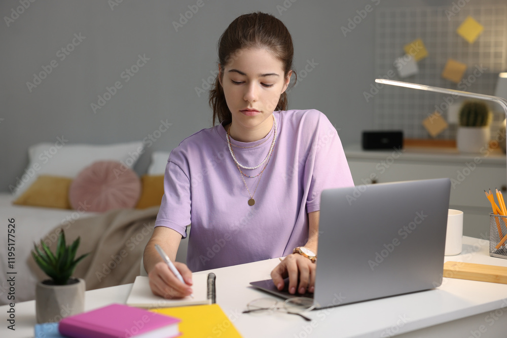 Student preparing for exam at table indoors Student preparing for exam at table indoors