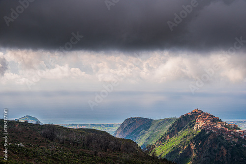 top view of the village of Grisolia with a cloudy sky in the background, Cosenza