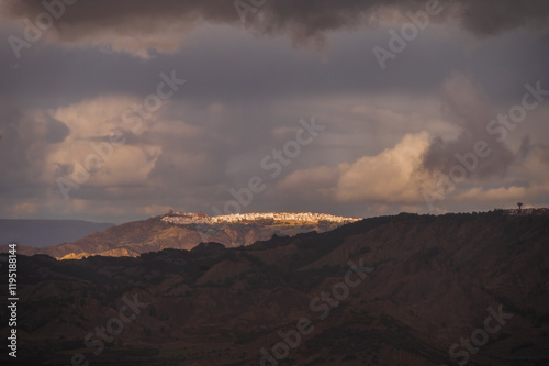 top view of the village of Grisolia with a cloudy sky in the background, Cosenza