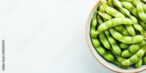 Wallpaper Mural Fresh green soybeans in a ceramic bowl, positioned top left, on a light pastel background, ideal for menus and food promotions with ample copy space. Torontodigital.ca