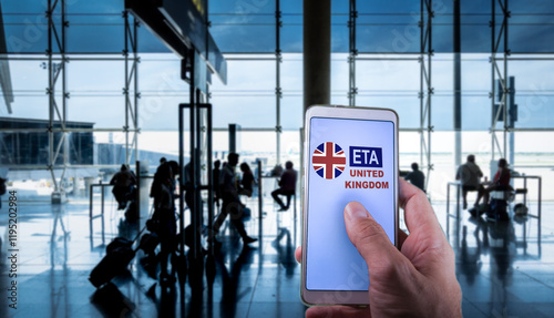 Fotografía Traveler using a smartphone app for applying ETAunited kingdom visa at the airpo