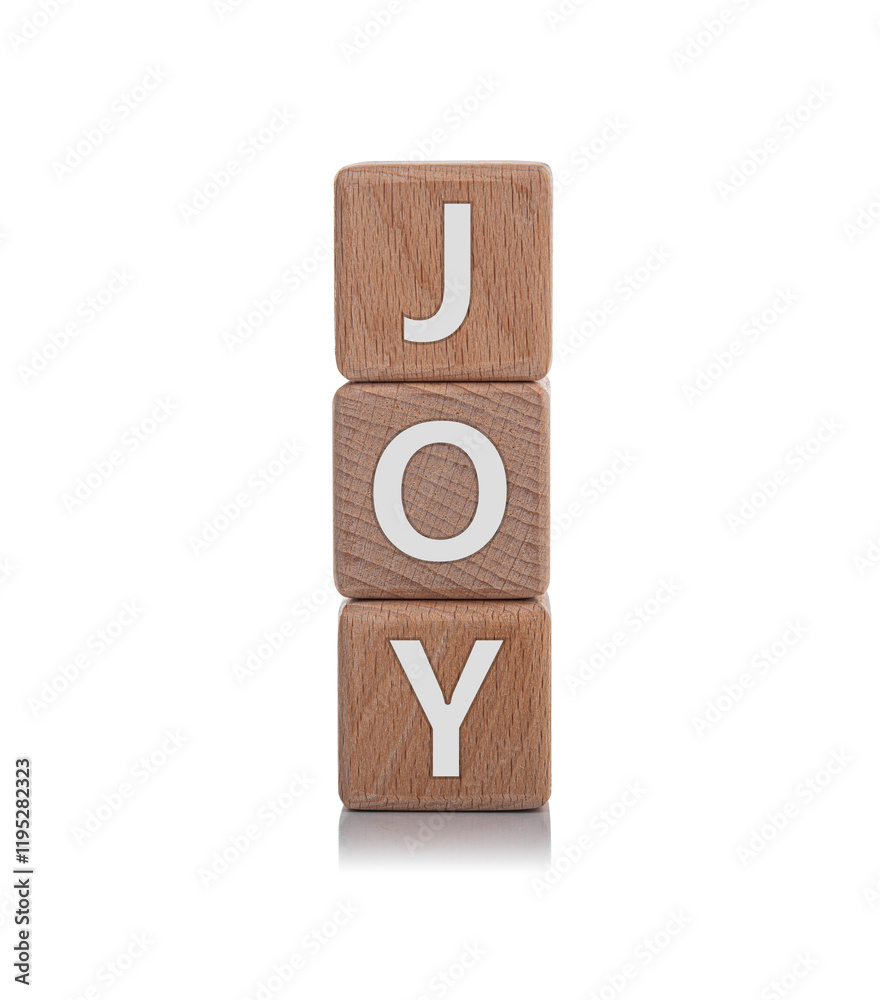 Wooden cubes with the inscription JOY on a white background.