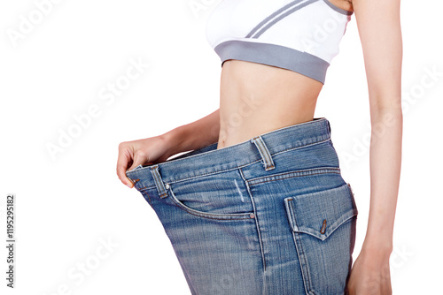 Wallpaper Mural Woman shows weight loss. Slim woman is happy to show her big old jeans. Fit woman in oversize blue jeans on pastel pink background. Diet and weight loss concept. Torontodigital.ca