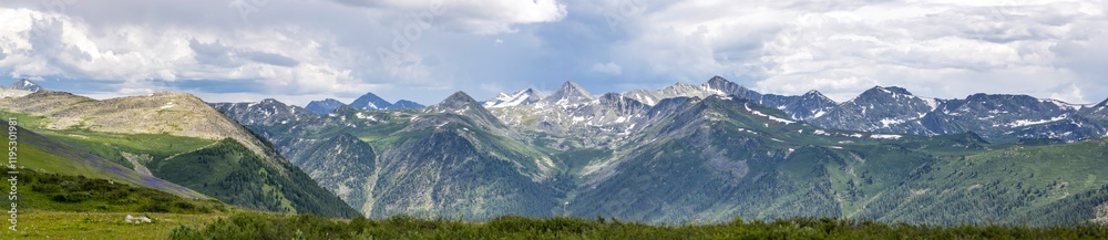 panorama of mountains and snow-capped peaks in eastern kazakhstan with clouds in the sky
panorama of mountains and snow-capped peaks in eastern kazakhstan with clouds in the sky