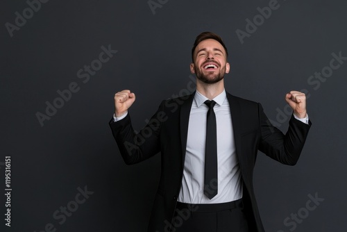 Businessman Celebrating Success with Smiles and Raised Fists in Suit