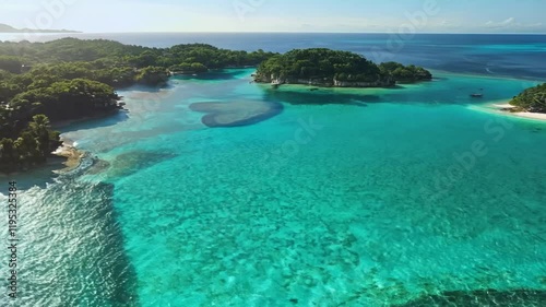 Aerial view of tropical islands with clear turquoise waters and lush greenery.