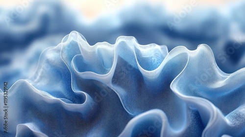 Abstract close-up of flowing blue fabric waves creating a serene atmosphere with soft light