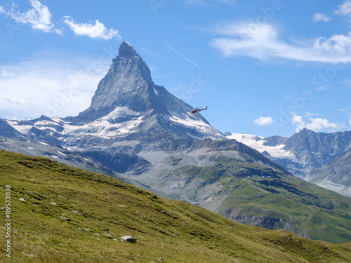 Rettungshubschrauber im Einsatz vor dem Matterhorn bei Zermatt photo