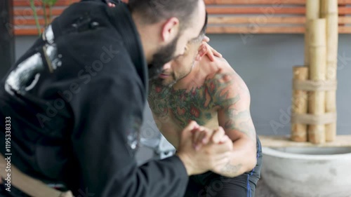 Wallpaper Mural Two male athletes practicing jiu jitsu performing grappling movements and different holds Torontodigital.ca