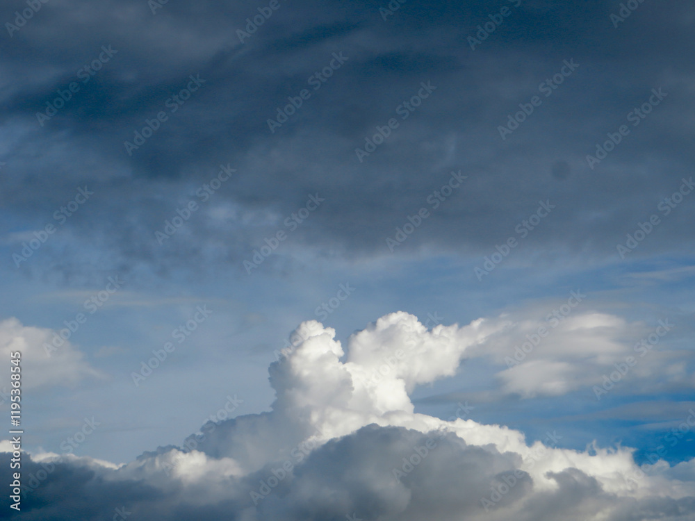 Dramatic Sky with Towering Cumulus Clouds Against a Deep Blue Backdrop – Nature’s Changing Moods Dramatic Sky with Towering Cumulus Clouds Against a Deep Blue Backdrop – Nature’s Changing Moods
