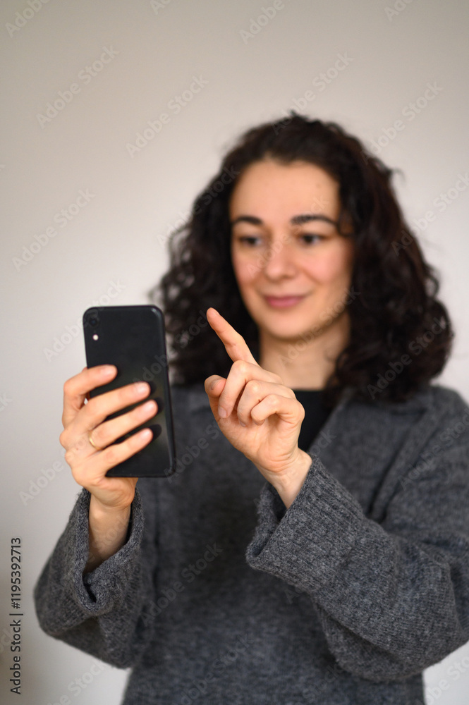 An isolated woman's portrait with a cell phone An isolated woman's portrait with a cell phone