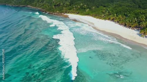 Aerial view of a serene beach with turquoise waters and lush green hills.