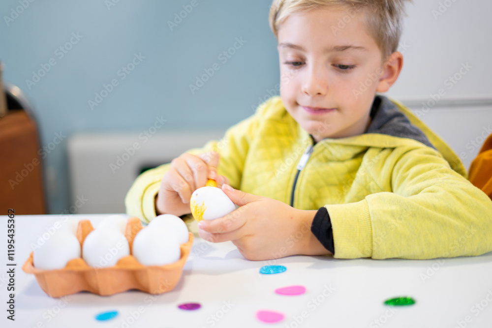 Child painting easter eggs at home getting ready for easter celebration Child painting easter eggs at home getting ready for easter celebration
