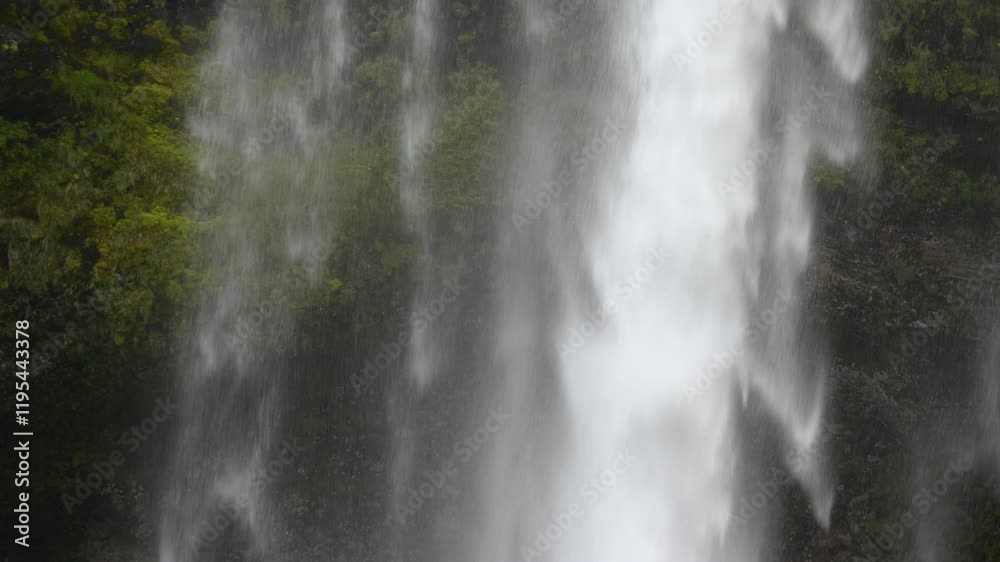 Powerful waterfall in Iceland. Water flows from the top of the mountains. Powerful destructive nature