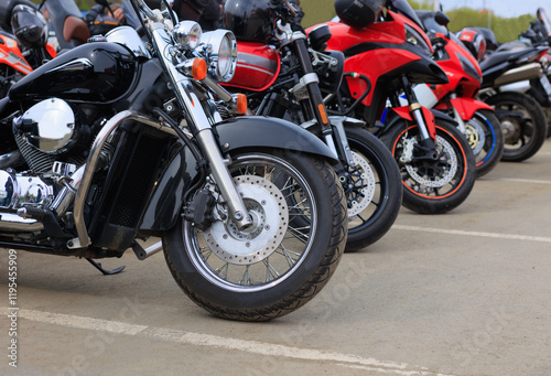 Fototapeta Naklejka Na Ścianę i Meble -  Motorcycles in a parking lot in the city