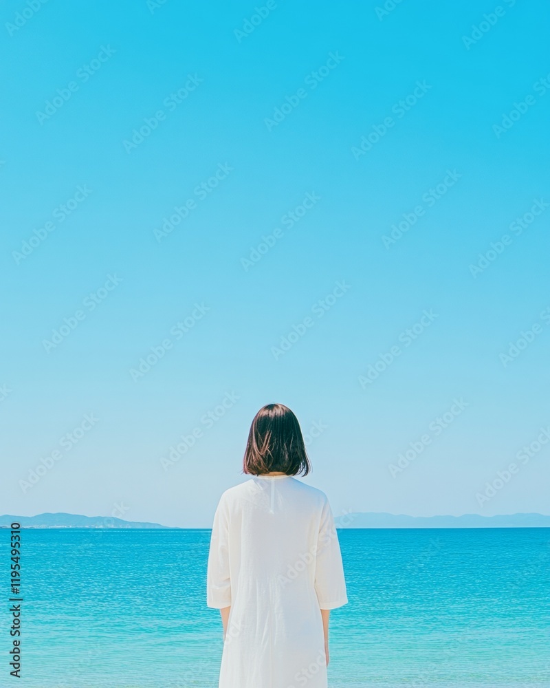 Serenity at the Seaside Young Woman in White Dress Gazing at Blue Horizon Serenity at the Seaside Young Woman in White Dress Gazing at Blue Horizon
