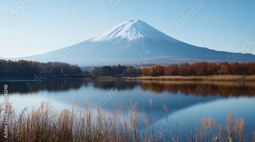 Mount fuji reflecting in lake kawaguchiko during autumn foliage season photo