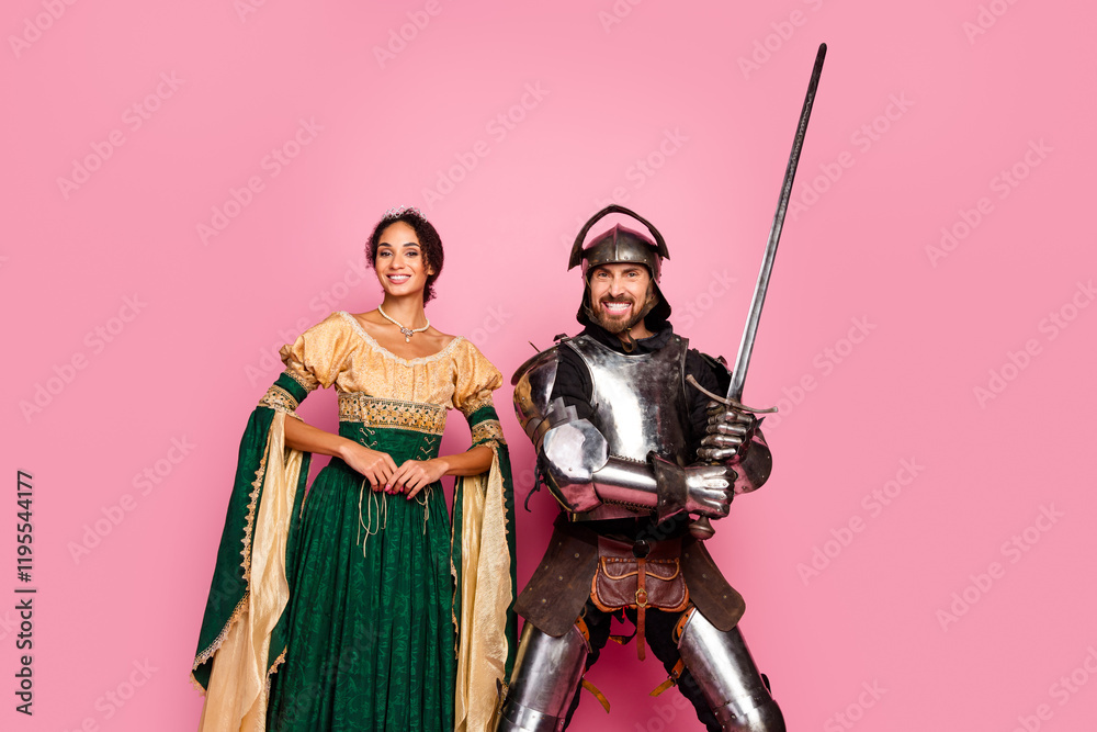 Naklejka premium Smiling Couple in Medieval Knight and Princess Costumes with Pink Background Depicting Romance and Ancient Era Inspiration