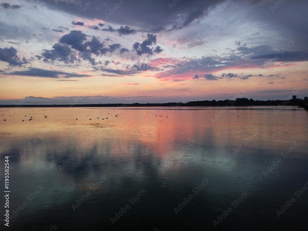 Raindrops on the lake, the lake reflects the sunset Raindrops on the lake, the lake reflects the sunset