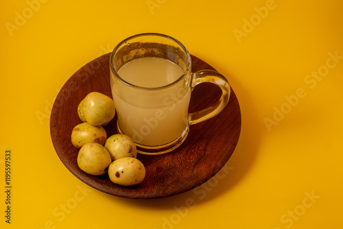 Freshly squeezed Marula (Sclerocarya birrea, Morula, Maroela, Mufula) fruit juice and traditional fermented beverage