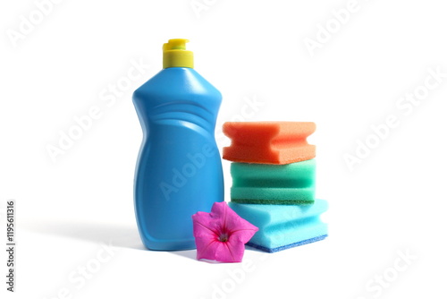 On a white background there is a blue bottle with detergent and sponges for washing dishes. photo