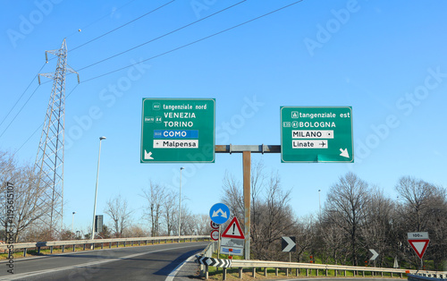 highway junction with signs pointing to northern italy destinations or to the airports of milan in ITALY photo