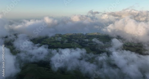 Azores coastline and landscape through the clouds. Vulcanic island in the atantic ocean. photo