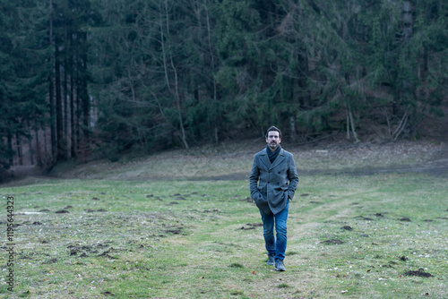 Young man walking in the woods	