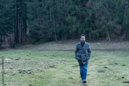Young man walking in the woods	