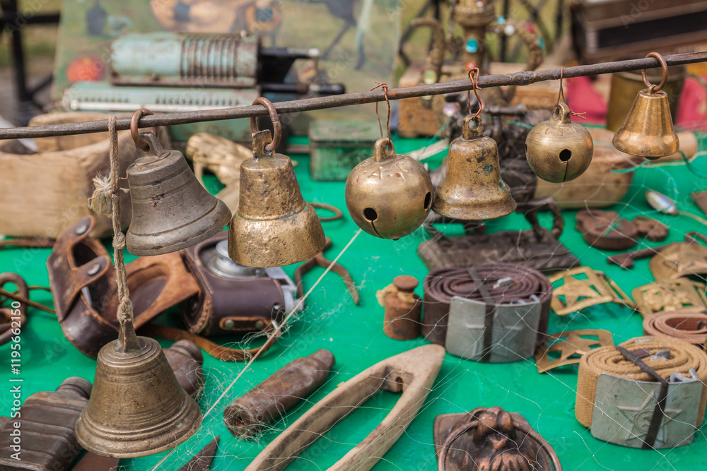 Antique bells, hand bells, jingle bells at a flea market Antique bells, hand bells, jingle bells at a flea market