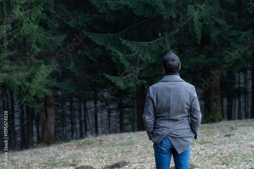 man walking in the woods