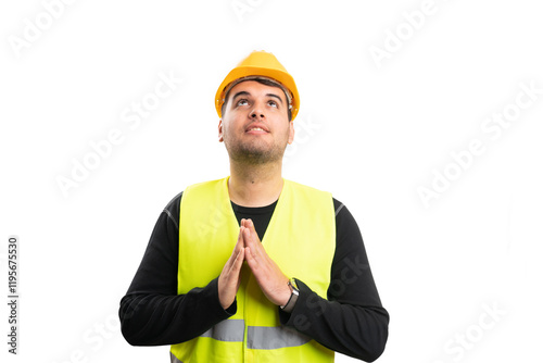 Faithful builder man making praying gesture looking up