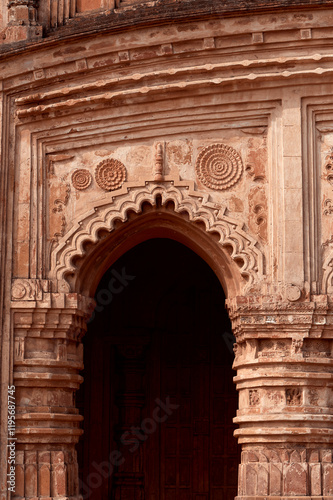 religious carvings on wall of Garh Panchakot Pancharatna temple, also known as Ras Mandir, 16th century Hindu terracotta temple built by Singh Deo dynasty of Panchkot. Now a popular travel destination photo