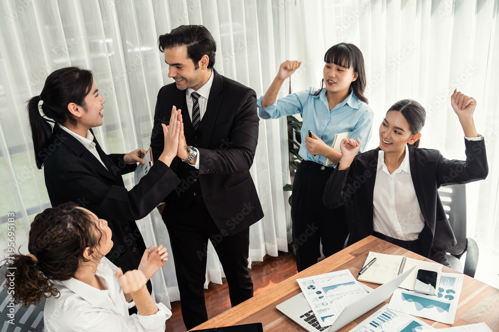 Group of happy businesspeople in high five gesture and successful efficient teamwork. Diverse race office worker celebrate after made progress on marketing planning in corporate office. Meticulous Group of happy businesspeople in high five gesture and successful efficient teamwork. Diverse race office worker celebrate after made progress on marketing planning in corporate office. Meticulous