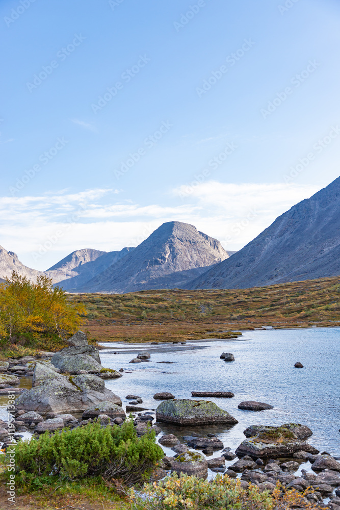 View to Petrelius river valley at Khibiny mountains. Early autumn in arctic tundra region. Kola peninsula, Murmansk region, Russia.
