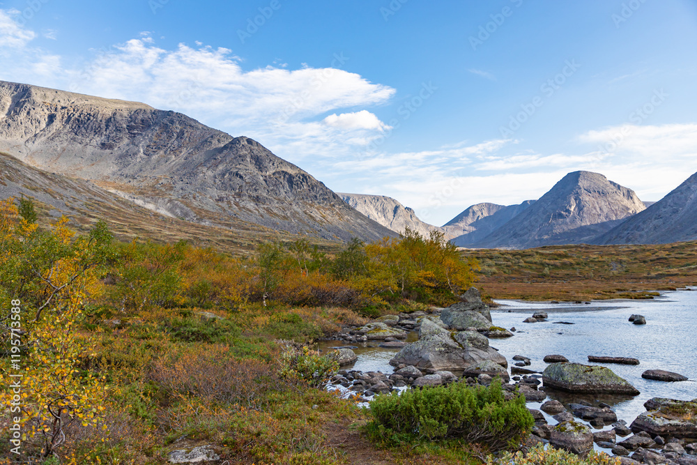 View to Petrelius river valley at Khibiny mountains. Early autumn in arctic tundra region. Kola peninsula, Murmansk region, Russia.