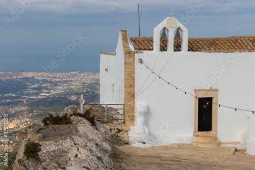 At the top of Mount Juchtas, in Archanes, with the well-known Greek Orthodox church of the monastery of Sotira Christos, better known as Afentis Christos. 