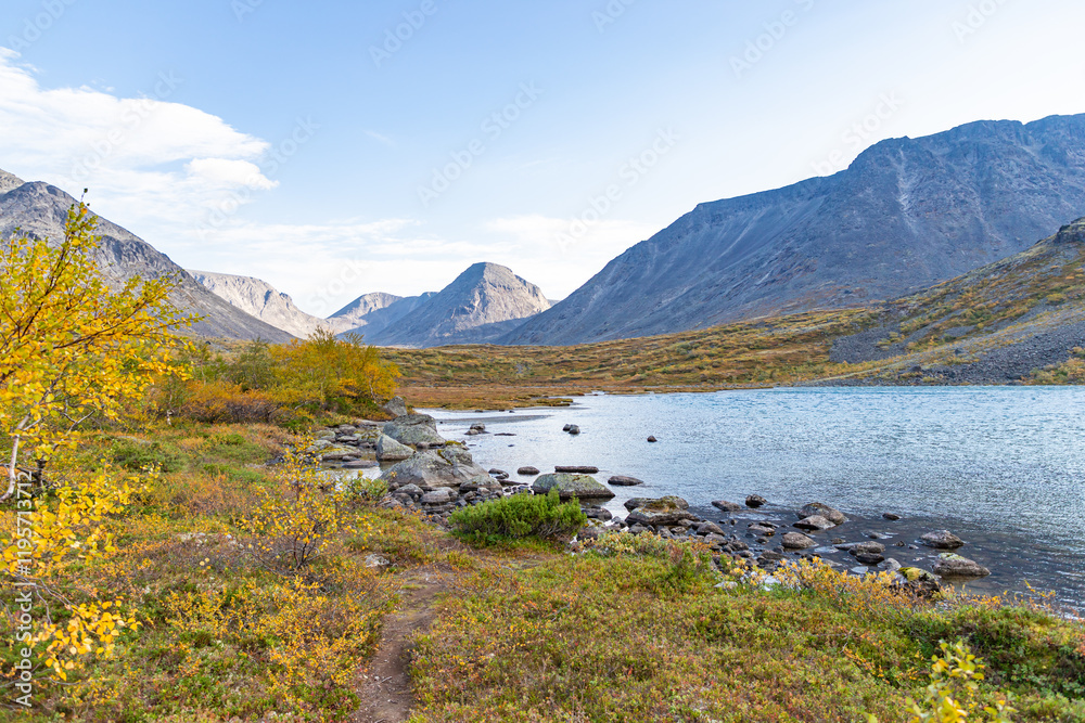 View to Petrelius river valley at Khibiny mountains. Early autumn in arctic tundra region. Kola peninsula, Murmansk region, Russia.