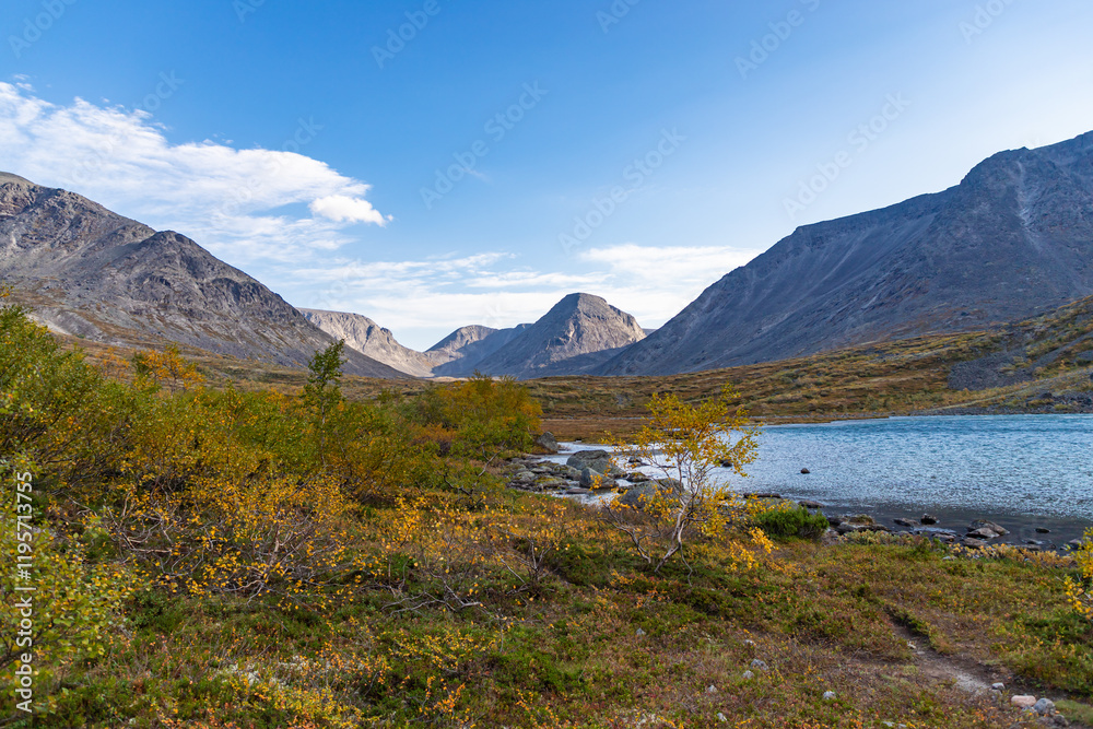 View to Petrelius river valley at Khibiny mountains. Early autumn in arctic tundra region. Kola peninsula, Murmansk region, Russia.