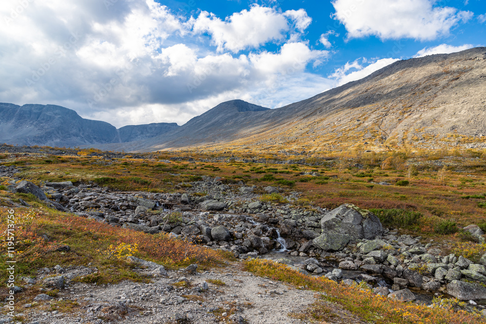 View to Petrelius river valley at Khibiny mountains. Early autumn in arctic tundra region. Kola peninsula, Murmansk region, Russia.