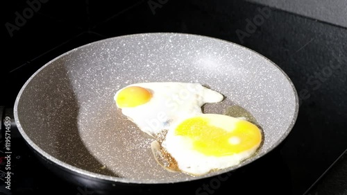 Frying pan with fried eggs cooking. High quality 4k footage