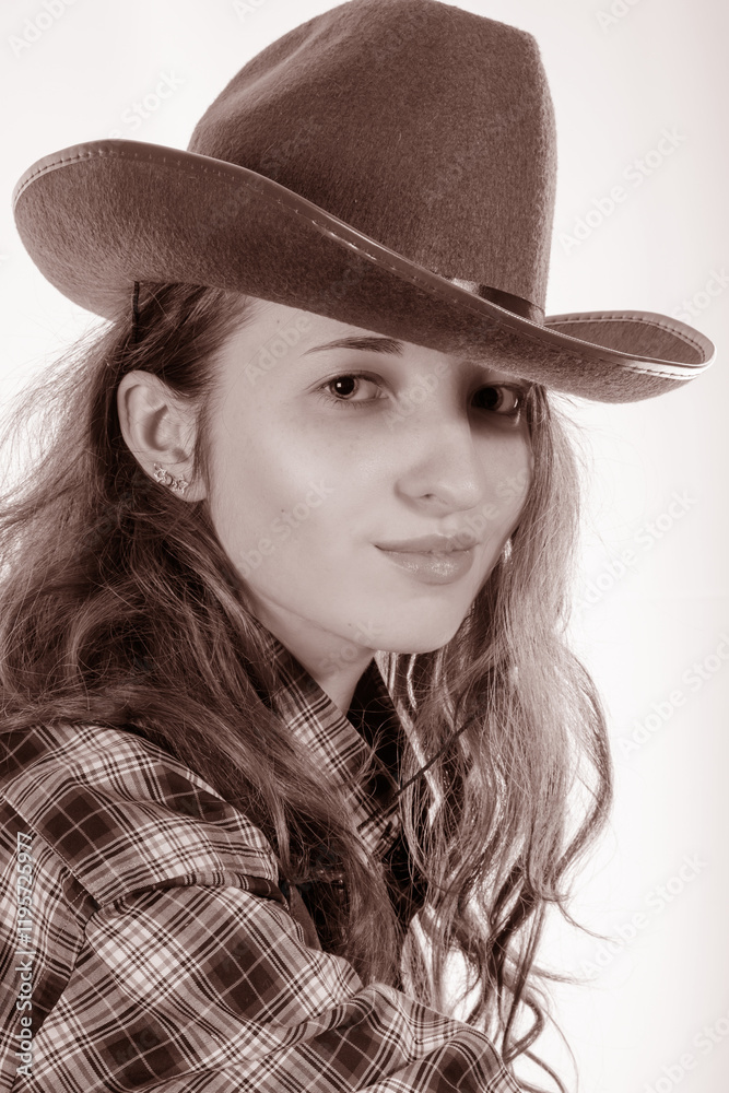 Portrait of an attractive girl in a cowboy hat Portrait of an attractive girl in a cowboy hat