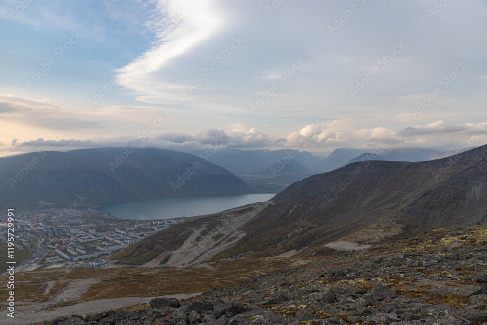 KIROVSK, RUSSIA - SEPTEMBER 12, 2024: Lake Bolshoy Vudyavr in the Khibiny Mountains with the town Kirovsk