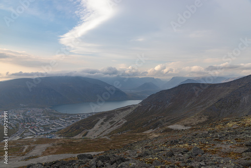 Obraz na płótnie KIROVSK, RUSSIA - SEPTEMBER 12, 2024: Lake Bolshoy Vudyavr in the Khibiny Mountains with the town Kirovsk w salonie