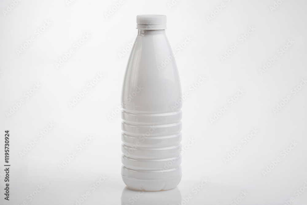 White plastic yogurt or milk bottle mockup with blank label.
White plastic yogurt or milk bottle mockup with blank label.