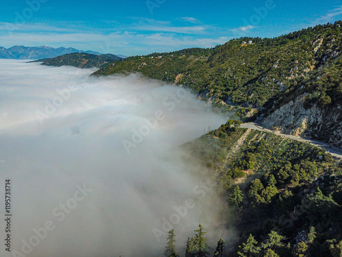 Fog against the mountains aerial photo