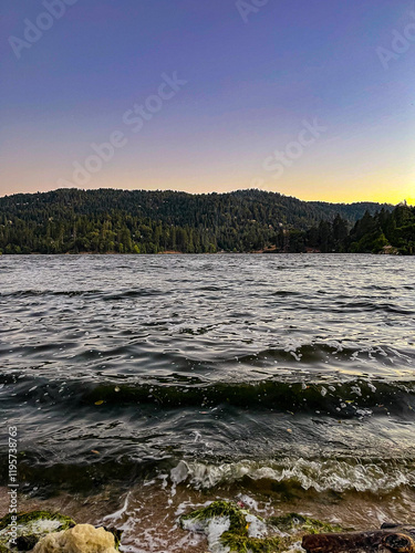 Sunset over the lake in the mountains photo