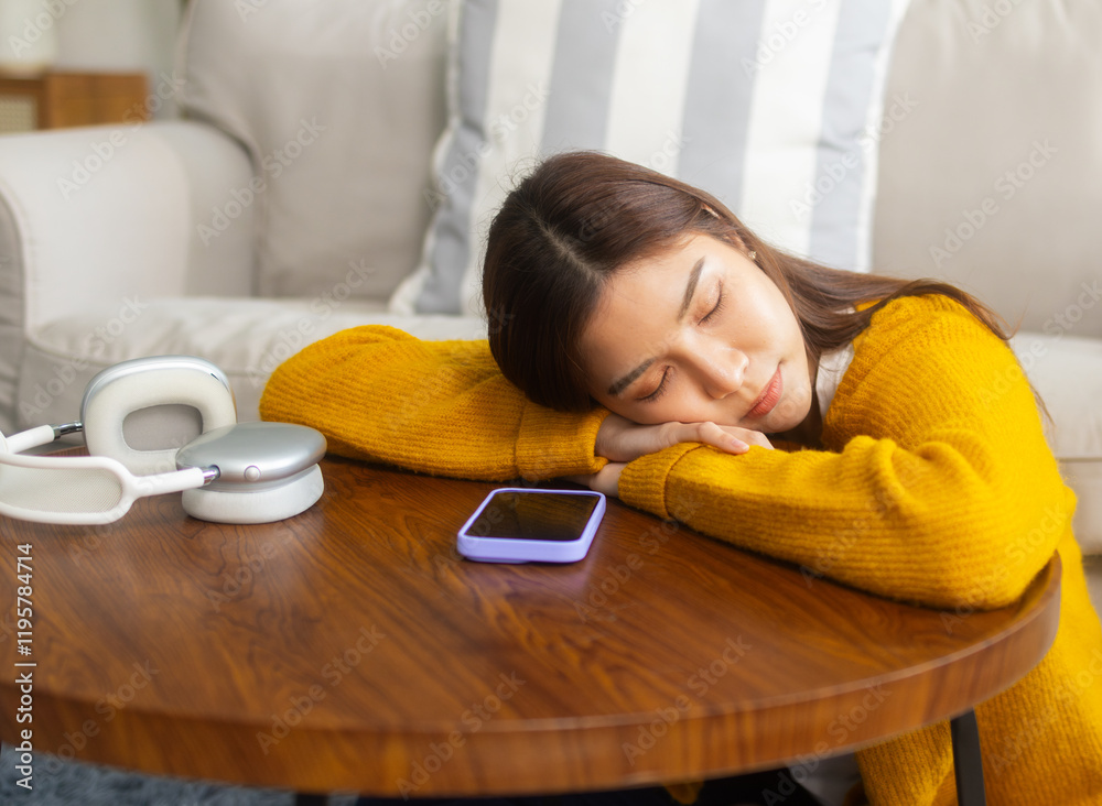 Attractive young Asian woman takes a nap resting peacefully during the weekend at home. Pretty young Asian woman daydreaming and taking a break for relief and refreshment during a calm nap at home. Attractive young Asian woman takes a nap resting peacefully during the weekend at home. Pretty young Asian woman daydreaming and taking a break for relief and refreshment during a calm nap at home.